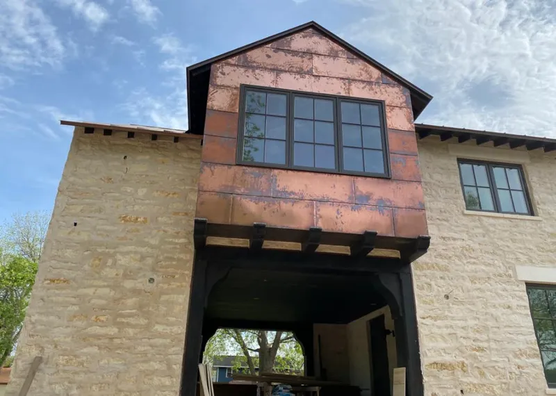 Copper metal panel facade on a stone building for Skylight Installation in Cahokia Heights